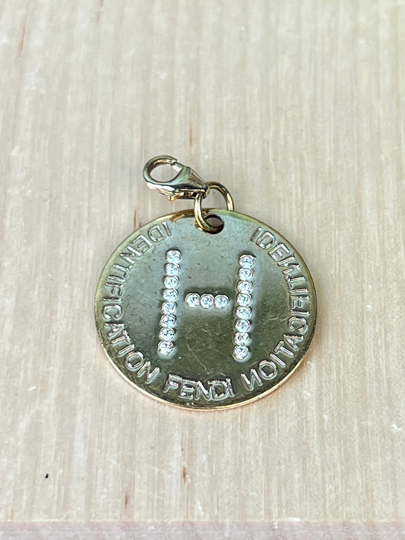 Fendi identification outlet charm