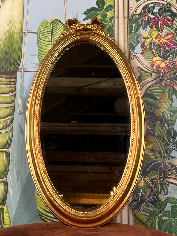 Mirror with bow