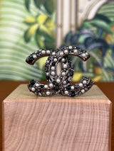 Chanel brooch in silver with pearls and stones